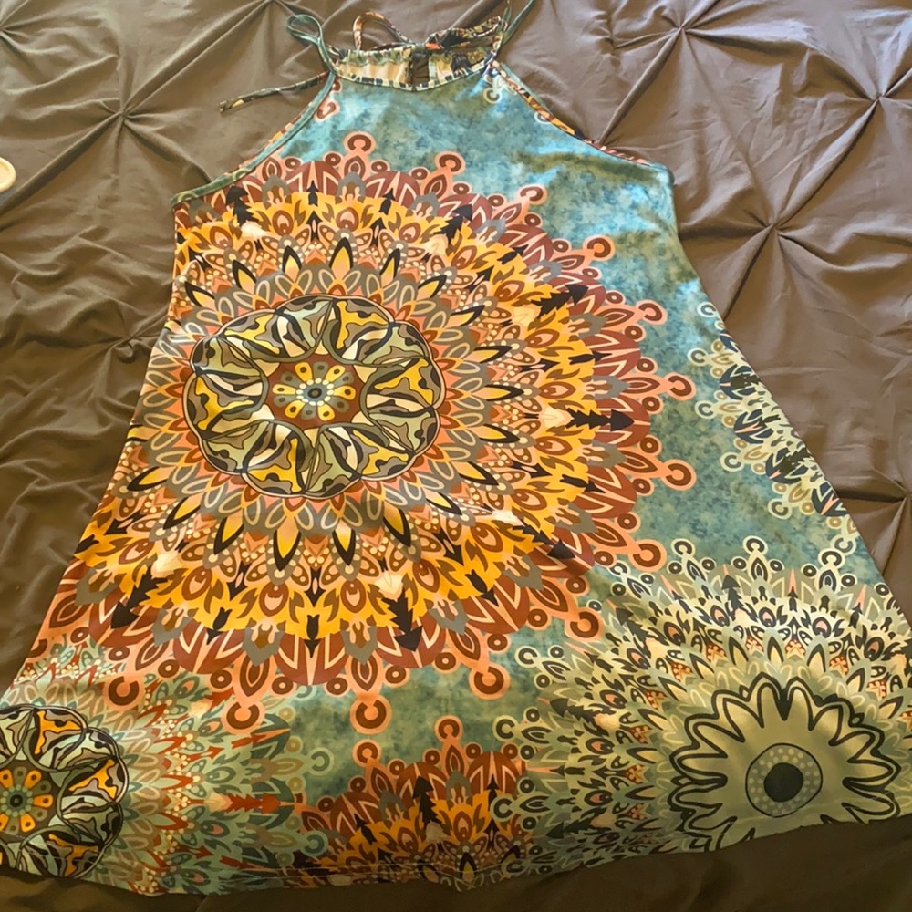 Turquoise dress with kaleidoscope print.